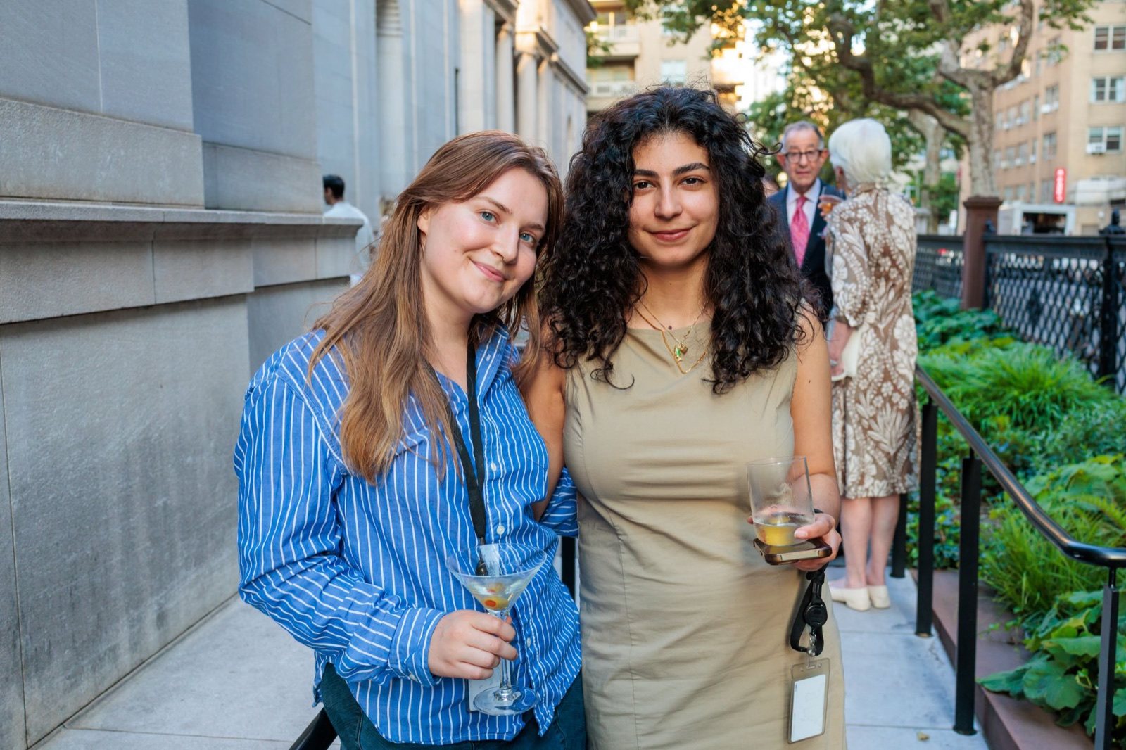 Elika and a colleague with drinks in the garden