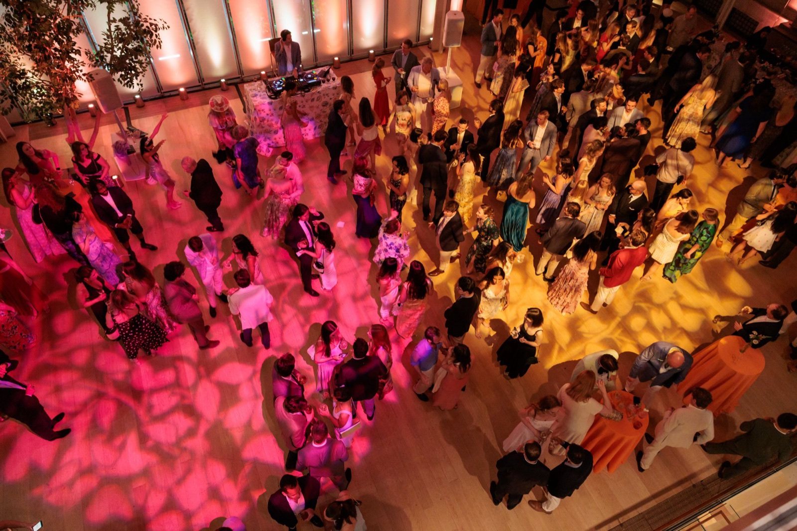The Young Fellows dance floor from above, washed in pink and gold light